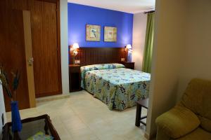 Posteľ alebo postele v izbe v ubytovaní Hotel Rocio