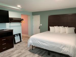 Ένα ή περισσότερα κρεβάτια σε δωμάτιο στο Atlantic Shores Motel