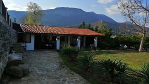 a house with a view of a mountain at Къща за гости "Мечта" in Lyutibrod