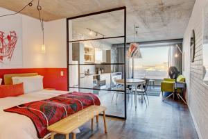 a bedroom with a bed and a desk at Wex1 Private Apartments in Cape Town