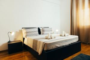 Ένα ή περισσότερα κρεβάτια σε δωμάτιο στο B&B CultRoma Roof Garden