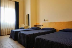 Postel nebo postele na pokoji v ubytování Albergo Ristorante Saverino + 37 fotografií