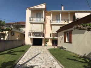 a large house with a walkway in front of it at Flokos in Lygia