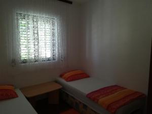Postel nebo postele na pokoji v ubytování Apartmani Mataija