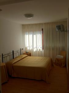 Cama o camas de una habitación en Guesthouse Alloggi Agli Artisti