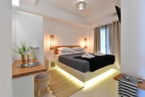 Postel nebo postele na pokoji v ubytování Ammos Luxury Rooms & Home