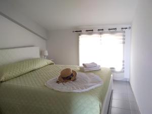Säng eller sängar i ett rum på CentroCittà Beach
