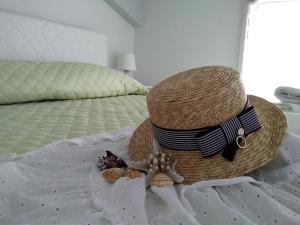 Postel nebo postele na pokoji v ubytování CentroCittà Beach