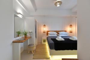 Postel nebo postele na pokoji v ubytování Ammos Luxury Rooms & Home