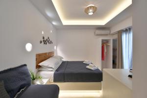 Postel nebo postele na pokoji v ubytování Ammos Luxury Rooms & Home