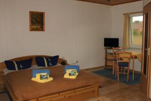 Tempat tidur dalam kamar di Pension Jägerrast