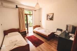 Postel nebo postele na pokoji v ubytování Hotel Relax