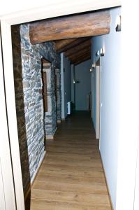a room with a wooden floor and wooden walls at PENSION SERRANO in Sarria