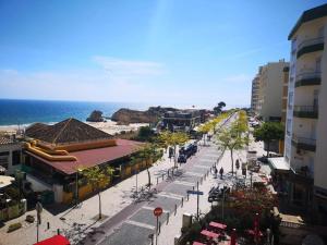 a city street with a beach and the ocean at Flor da Beira By The Ocean in Portimão