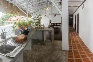 a kitchen with a long counter in a room at The Sky Hometel in Ko Tao