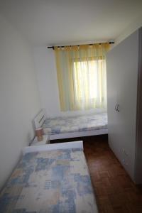 Posteľ alebo postele v izbe v ubytovaní Sun & Fun