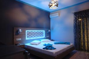 Posteľ alebo postele v izbe v ubytovaní Blue Dream Hotel