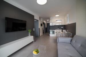 A kitchen or kitchenette at PR1MO Apartmanok
