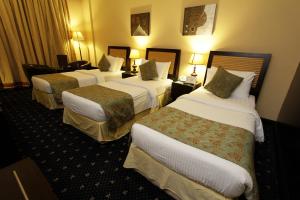 Postel nebo postele na pokoji v ubytování Dorus Hotel