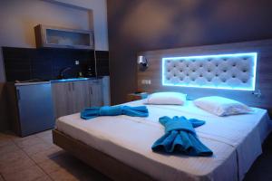 Posteľ alebo postele v izbe v ubytovaní Blue Dream Hotel