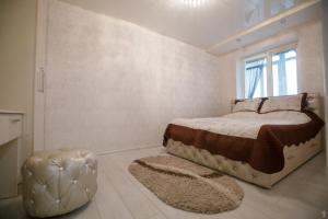 En eller flere senger på et rom på Apartments on Preobrazhenskaya