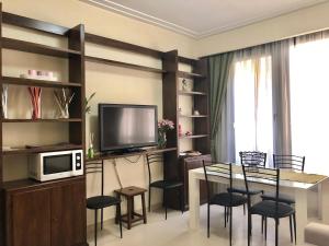 A television and/or entertainment centre at Visconti apartment.