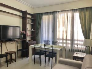 A television and/or entertainment centre at Visconti apartment.