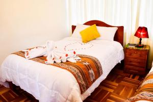 Postel nebo postele na pokoji v ubytování Hostal Comarca Imperial