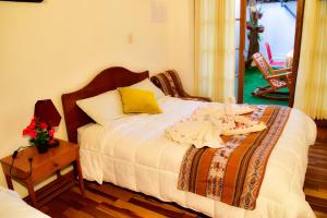 Postel nebo postele na pokoji v ubytování Hostal Comarca Imperial