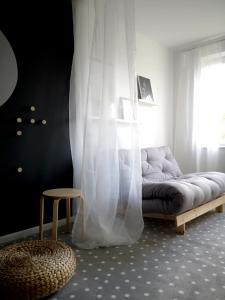 Posteľ alebo postele v izbe v ubytovaní APARTAMENT TARASY GDYNI z OGRÓDKIEM