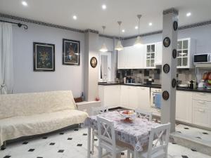 a living room with a couch and a table at Matteotti Apartment in Rapallo
