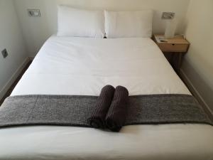 Postel nebo postele na pokoji v ubytování San Juan Guesthouse