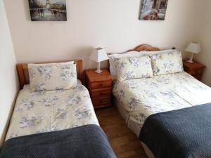 Postel nebo postele na pokoji v ubytování Seaview Cottage Dugort Achill Island