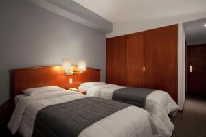 Postel nebo postele na pokoji v ubytování Hotel Moncloa