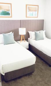 Voodi või voodid majutusasutuse Rumba Beach Resort toas