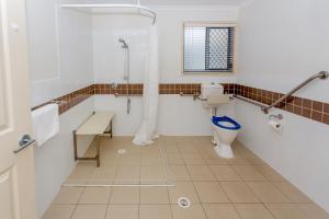 a bathroom with a toilet and a shower at BIG4 Sawtell Beach Holiday Park in Sawtell