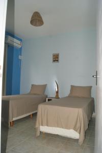 Ένα ή περισσότερα κρεβάτια σε δωμάτιο στο Seu Lar em Milagres +26 φωτογραφίες