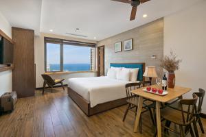Giường trong phòng chung tại White Sand Boutique Hotel