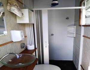 a bathroom with a sink and a toilet at Hostel Brooklin in São Paulo +35 photos