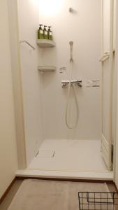 Ένα μπάνιο στο Okunikko Guesthouse JUN