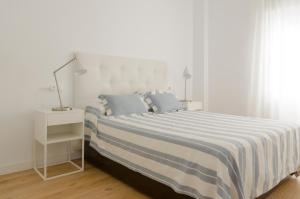 Postel nebo postele na pokoji v ubytování Deluxe La Trinidad