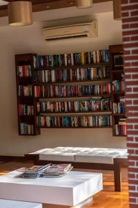 a room with a book shelf filled with books at Khaolak Bayfront Resort in Khao Lak +63 photos