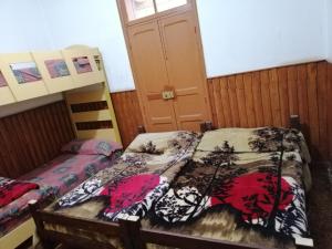 Postel nebo postele na pokoji v ubytování Tiger House Guest House
