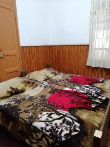 Postel nebo postele na pokoji v ubytování Tiger House Guest House