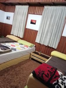 Postel nebo postele na pokoji v ubytování Tiger House Guest House