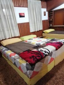 Postel nebo postele na pokoji v ubytování Tiger House Guest House