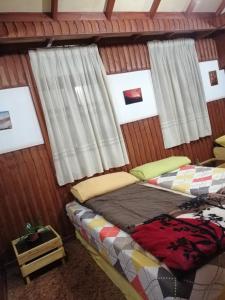 Postel nebo postele na pokoji v ubytování Tiger House Guest House