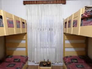 Postel nebo postele na pokoji v ubytování Tiger House Guest House