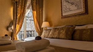 Voodi või voodid majutusasutuse Historic Boutique Hotel Cattaro toas