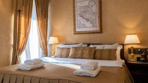Voodi või voodid majutusasutuse Historic Boutique Hotel Cattaro toas
